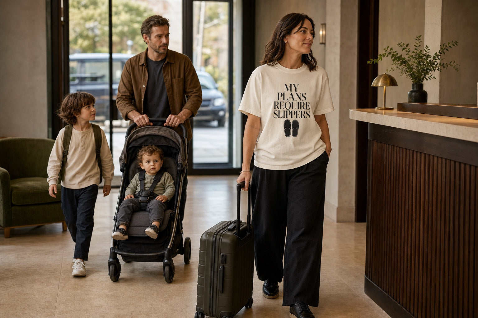 Family checking into a hotel with Spa Snob luggage-ready style